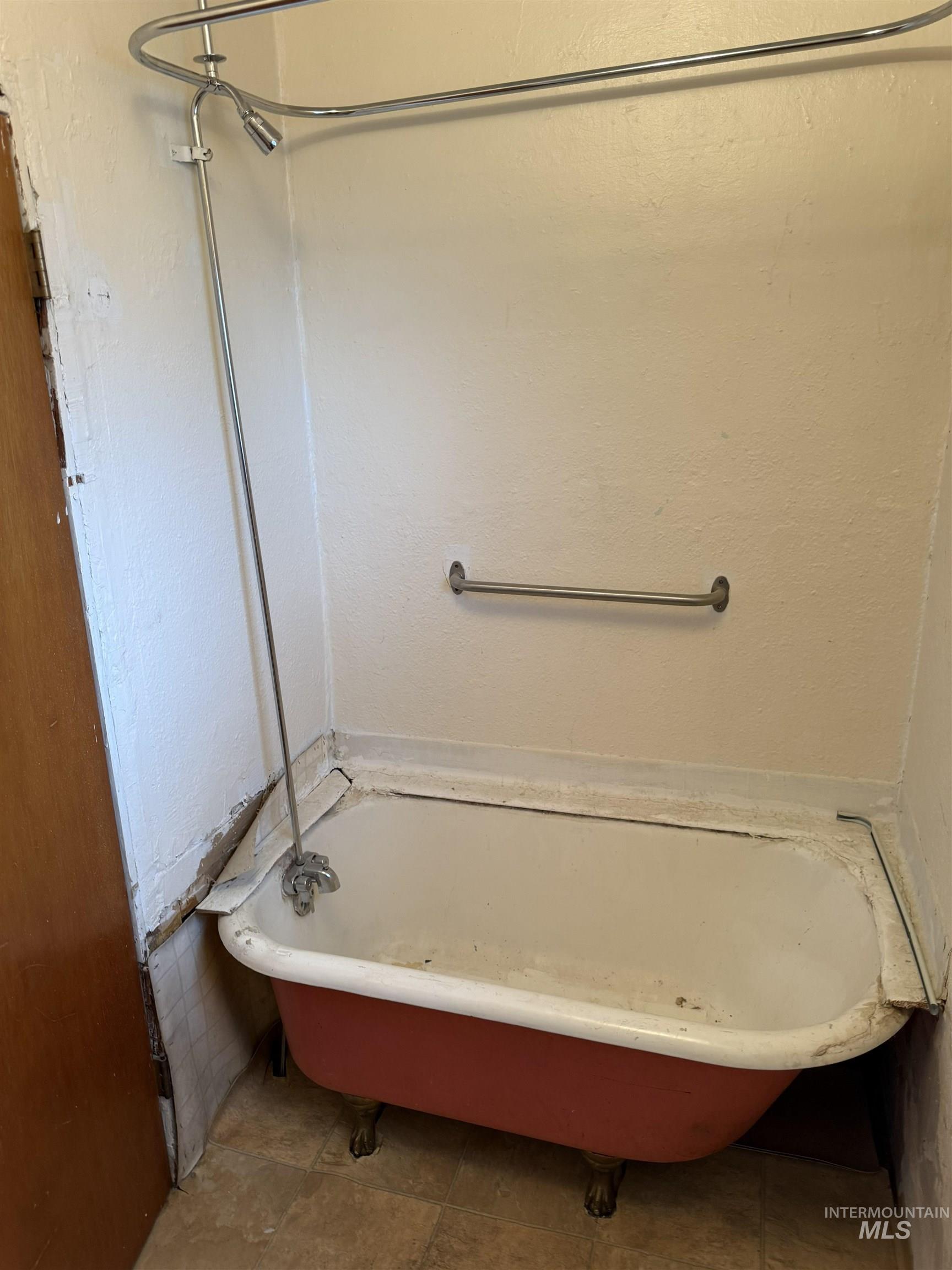 838 11th Street Clarkston, WA 99403 - Photo 8 of 20 Full bath with a freestanding tub and a textured wall