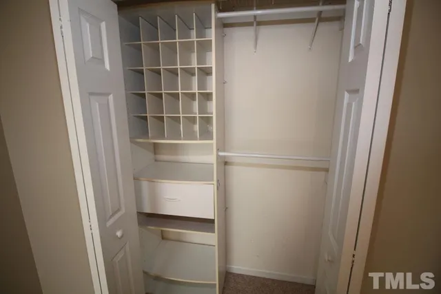 a view of an empty walk in closet