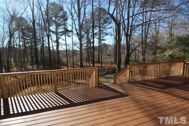 a view of deck with wooden floor and outdoor seating