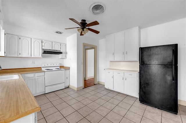 8164 Ranch Road 261 Buchanan Dam, TX 78609 - Photo 15 of 20 a kitchen with a refrigerator sink and cabinets