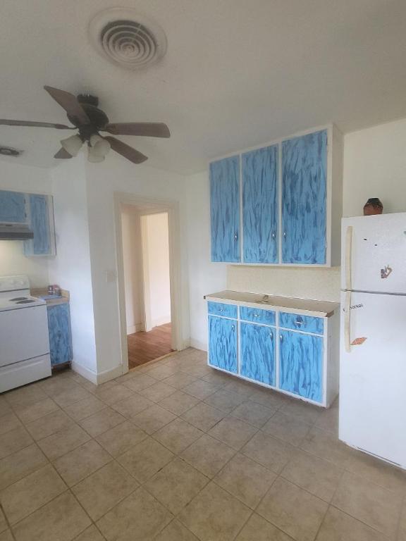 8164 Ranch Road 261 Buchanan Dam, TX 78609 - Photo 3 of 20 a view of a kitchen with a sink cabinets and window