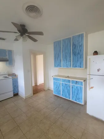 a view of kitchen with furniture and a window