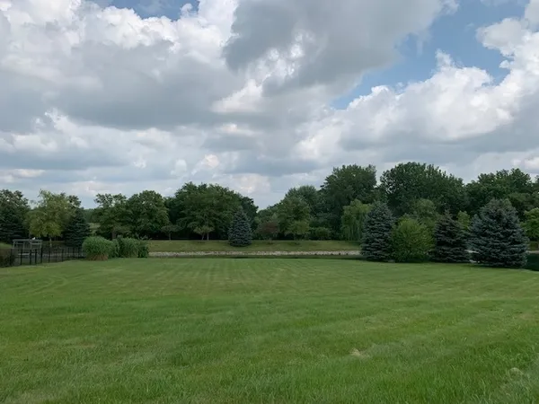 a view of a golf course with a lake