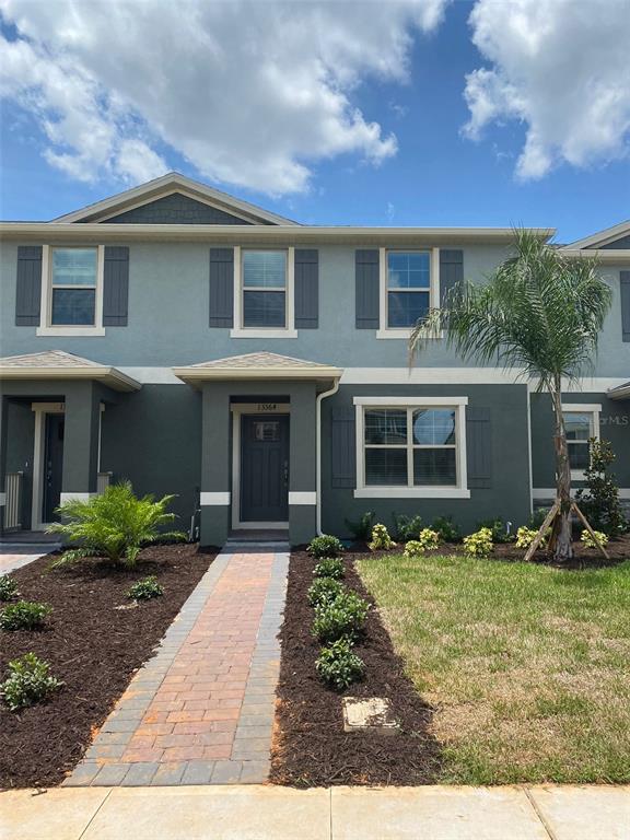 13364 Pontoon Road Winter Garden, FL 34787 - Photo 1 of 1 a front view of a house with garden