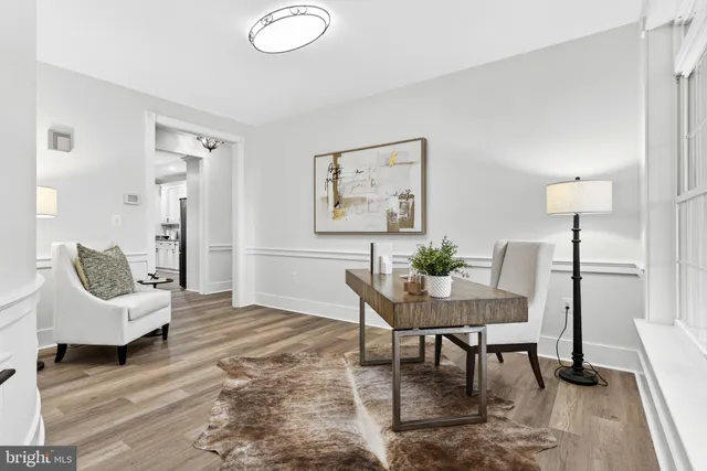 a kitchen with stainless steel appliances granite countertop a kitchen island hardwood floor sink stove and granite counter top