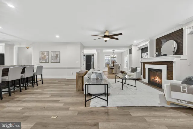 a large bathroom with a tub a sink and mirror