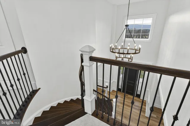 a view of a kitchen and dining room with wooden floor