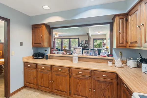 a kitchen with sink and cabinets