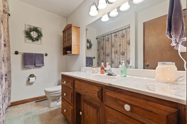 a view of a patio with table and chairs and wooden floor