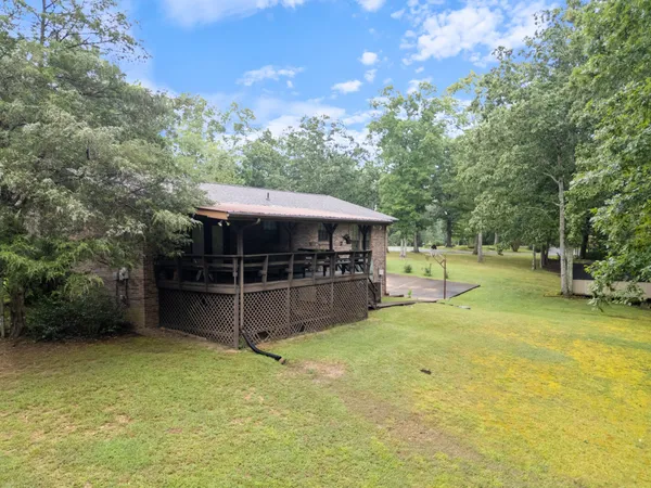 a view of a backyard with white house