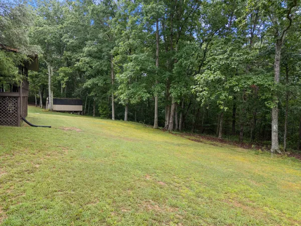 a view of a swimming pool with an outdoor space and seating area