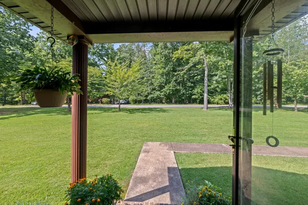 a view of a porch with a big yard