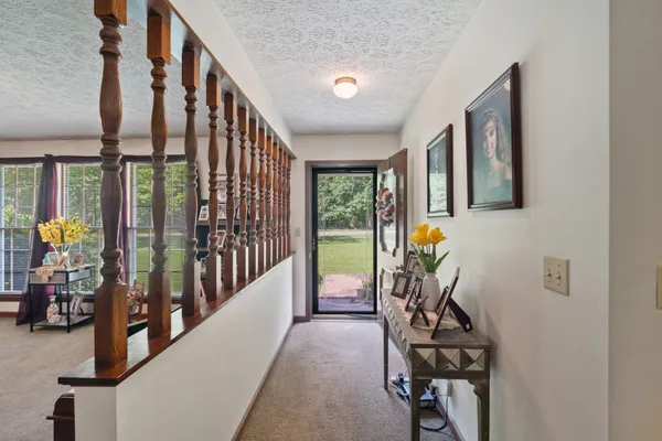 a view of an entryway with wooden floor