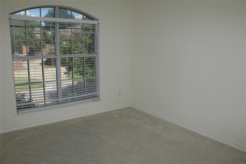4033 Cornish Place Plano, TX 75093 - Photo 16 of 23 a view of empty room with floor to ceiling window and ceiling fan