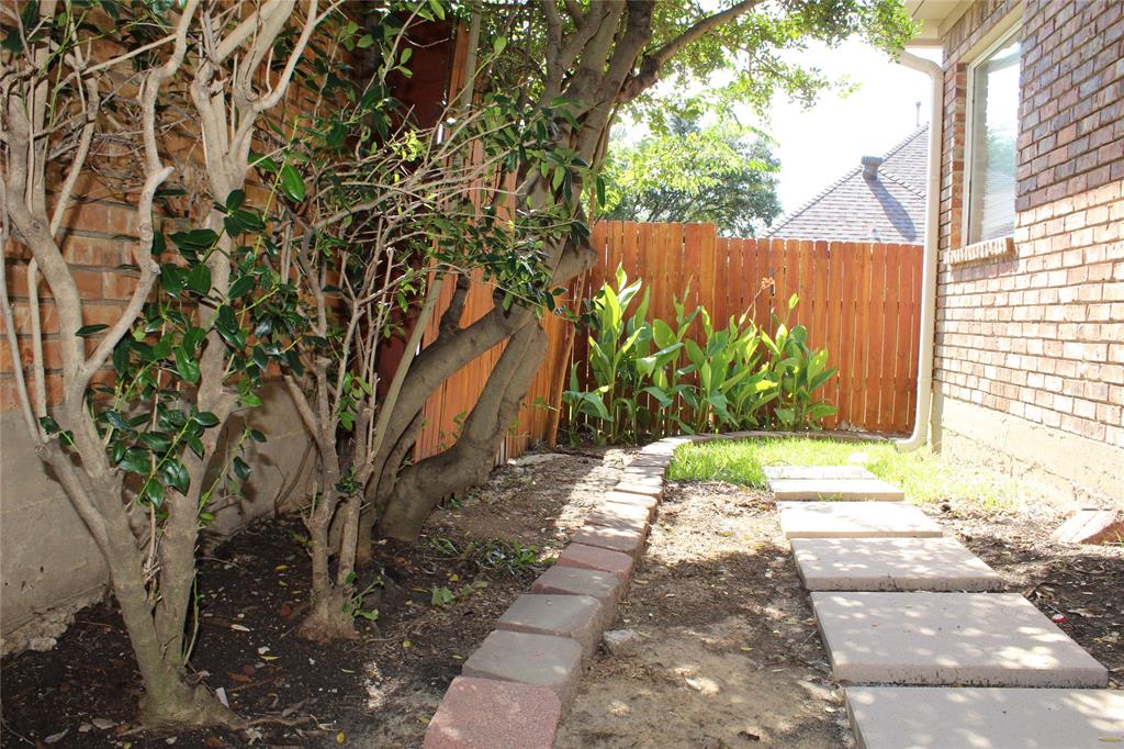 4033 Cornish Place Plano, TX 75093 - Photo 21 of 23 a view of a pathway in a yard with plants