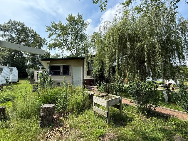 a view of a couches in backyard of house