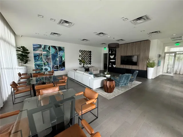 a living room with fireplace furniture and a flat screen tv