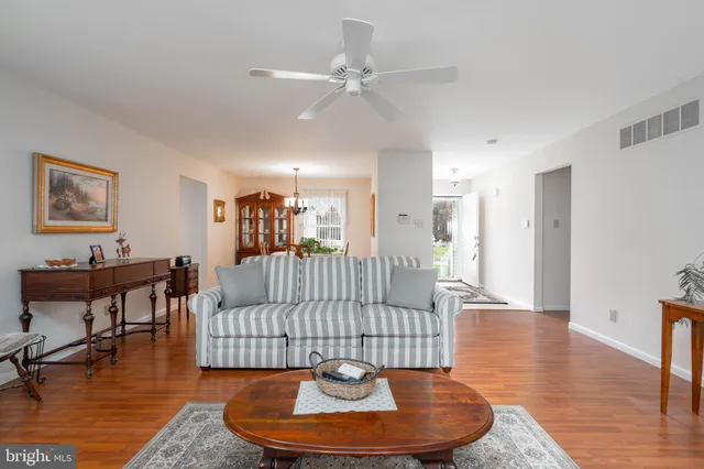 a living room with furniture fireplace and a flat screen tv