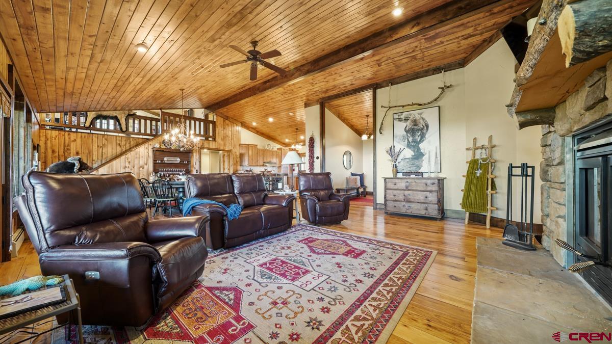 220 Ridge Road Cimarron, CO 81220 - Photo 13 of 45 a living room with furniture and a flat screen tv