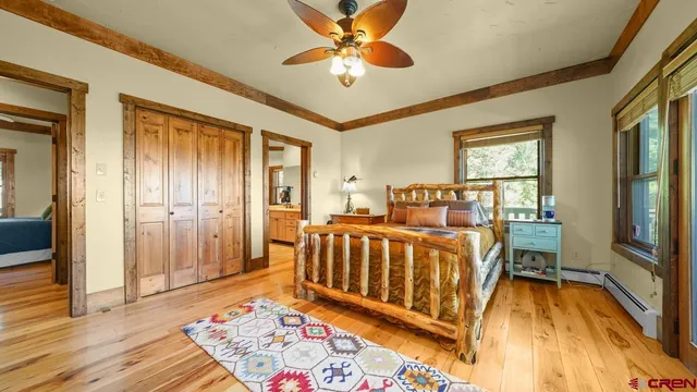 a bed room with a bed and a chandelier