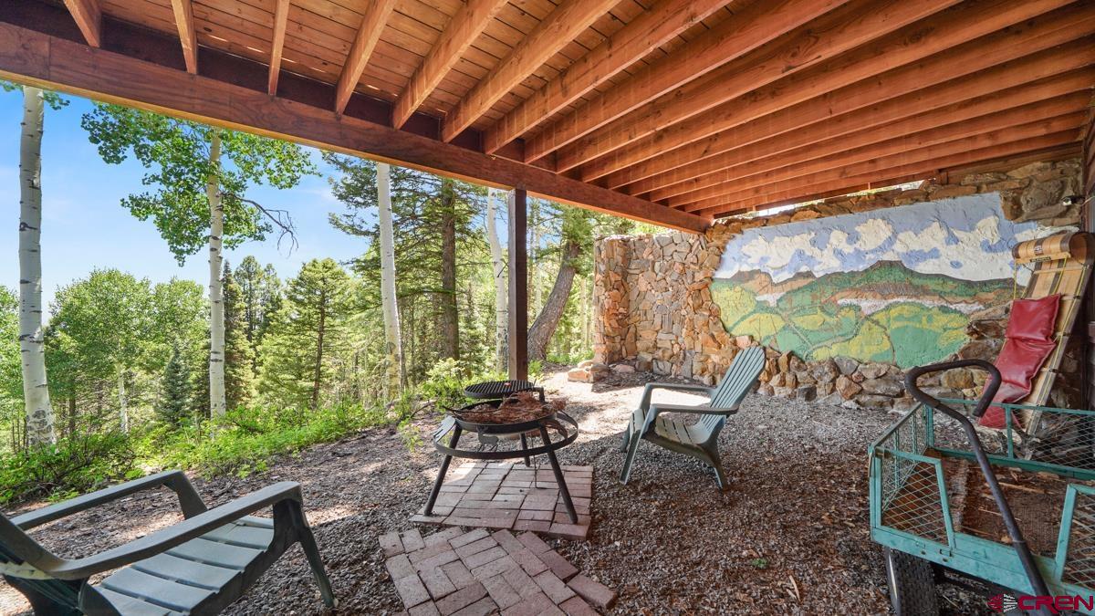 220 Ridge Road Cimarron, CO 81220 - Photo 25 of 45 a outdoor living space with furniture and a garden