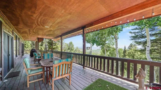 a view of a two chairs in the balcony
