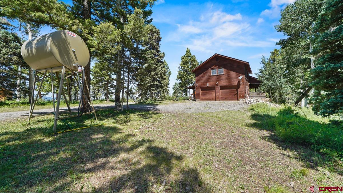 220 Ridge Road Cimarron, CO 81220 - Photo 41 of 45 a front view of a house with garden