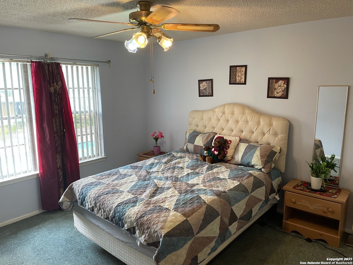 923 Vance Jackson Road, Unit 904 San Antonio, TX 78201 - Photo 7 of 11 a bedroom with a bed couch and window