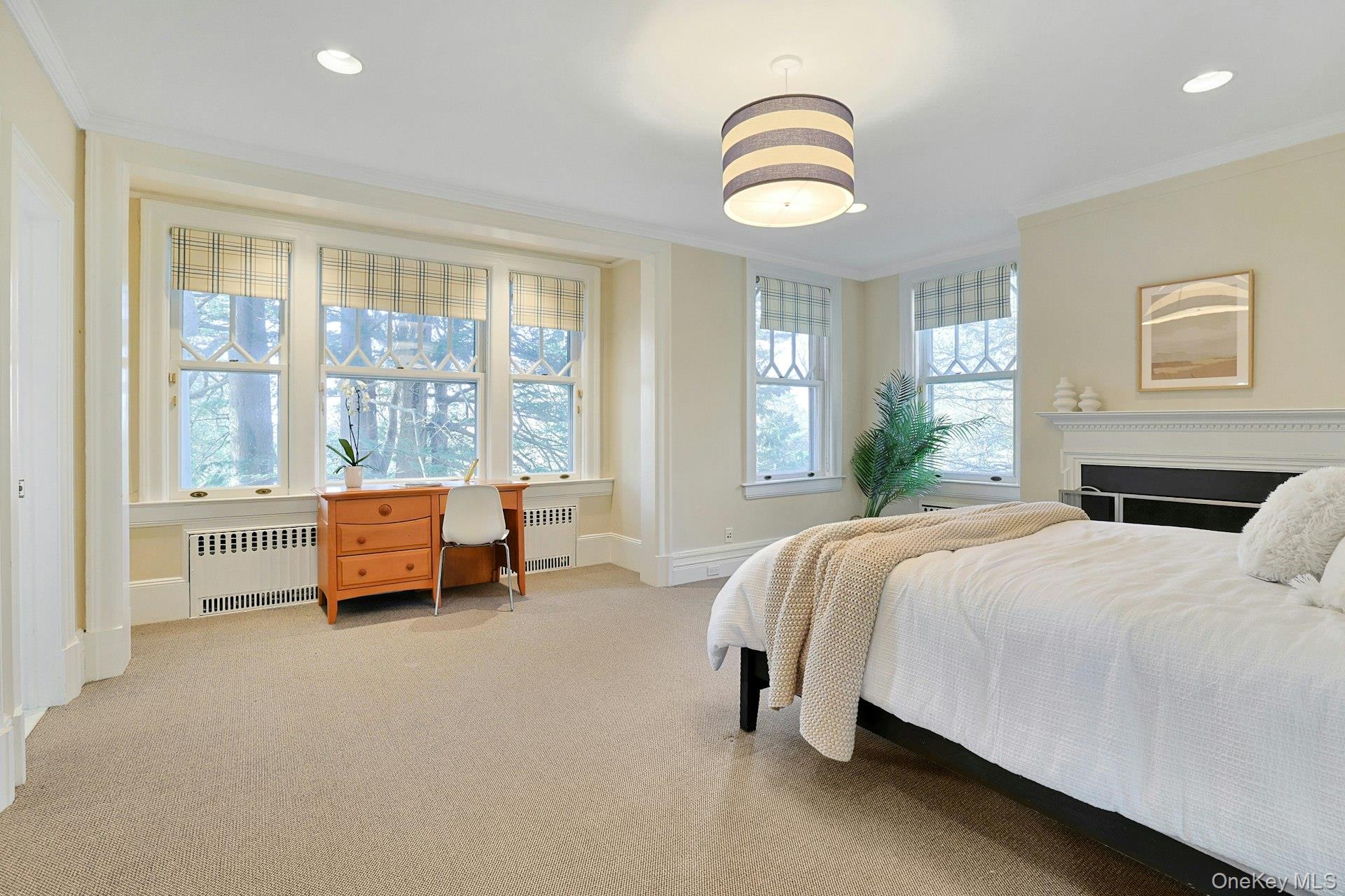 34 Park Road Scarsdale, NY 10583 - Photo 22 of 49 a spacious bedroom with a bed and a large window