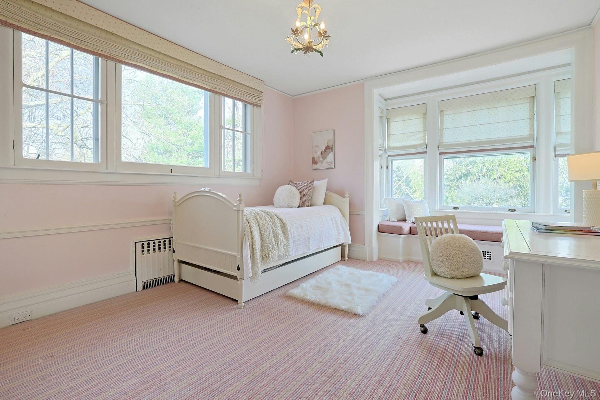 34 Park Road Scarsdale, NY 10583 - Photo 24 of 49 a spacious bedroom with a bed and windows