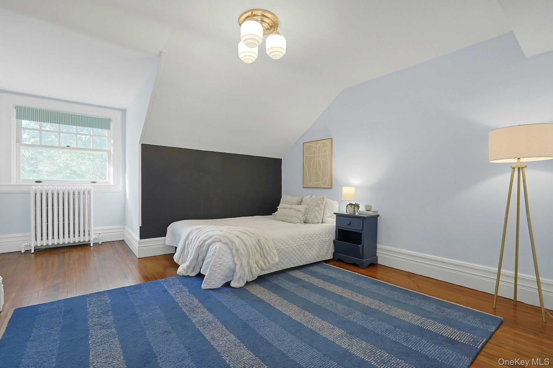 34 Park Road Scarsdale, NY 10583 - Photo 26 of 49 a bed room with a bed and a lamp