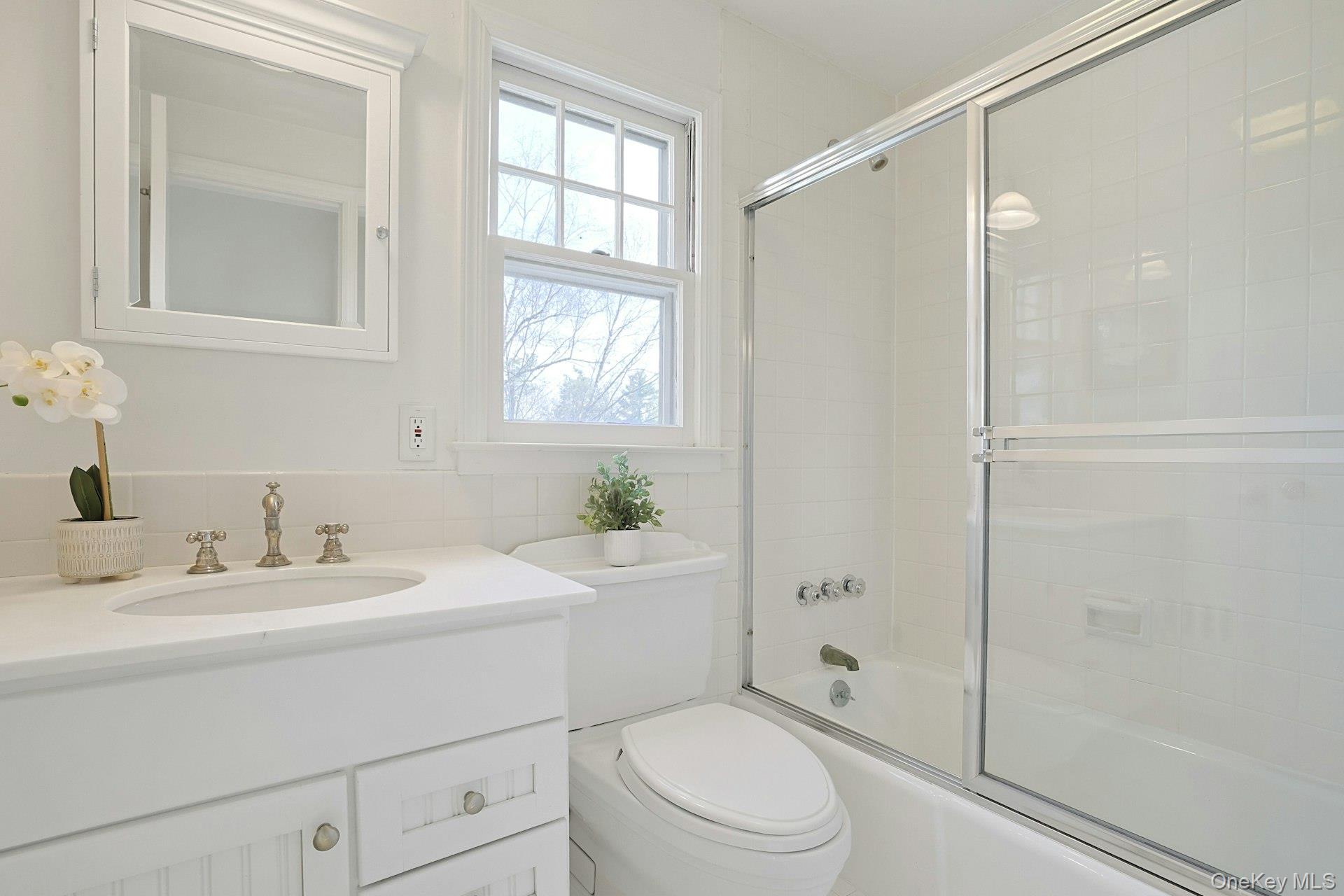 34 Park Road Scarsdale, NY 10583 - Photo 28 of 49 a bathroom with a sink a toilet and shower