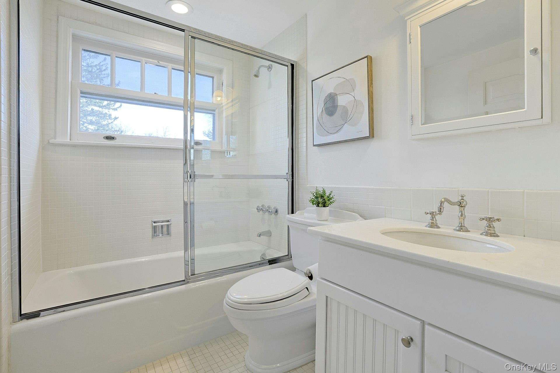 34 Park Road Scarsdale, NY 10583 - Photo 31 of 49 a bathroom with a granite countertop sink toilet and shower