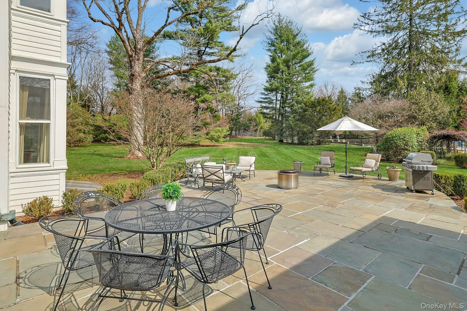34 Park Road Scarsdale, NY 10583 - Photo 34 of 49 a view of a patio with furniture and a yard