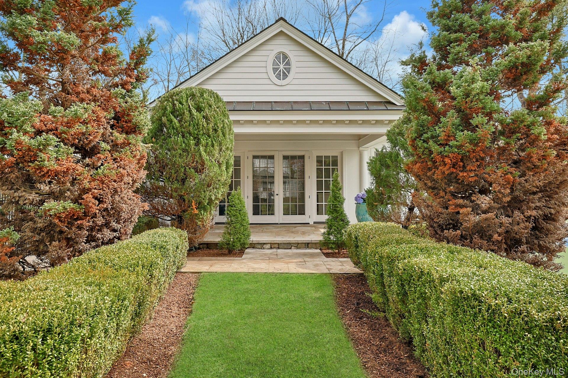 34 Park Road Scarsdale, NY 10583 - Photo 36 of 49 a front view of a house with a yard
