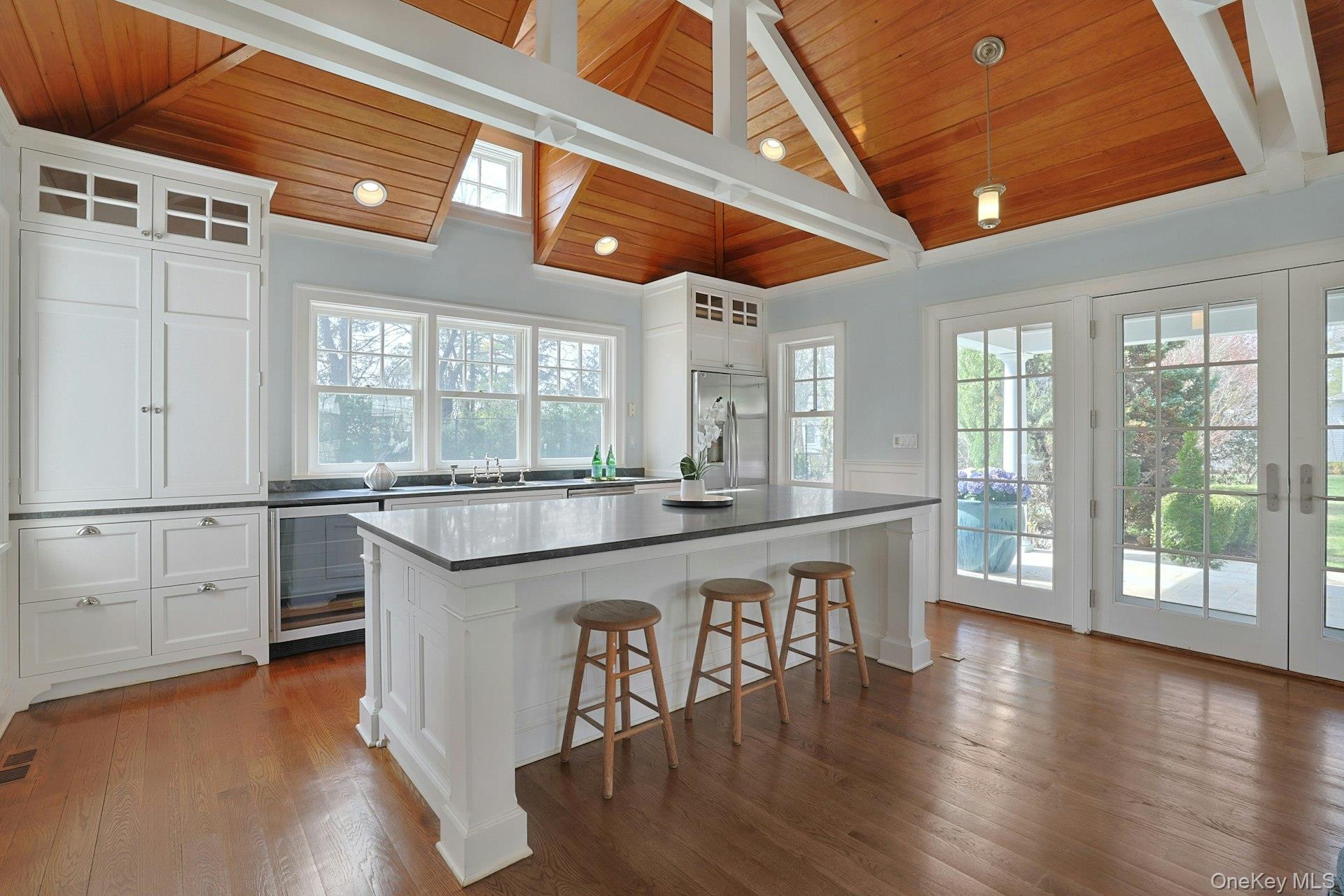 34 Park Road Scarsdale, NY 10583 - Photo 38 of 49 a large kitchen with a table and chairs