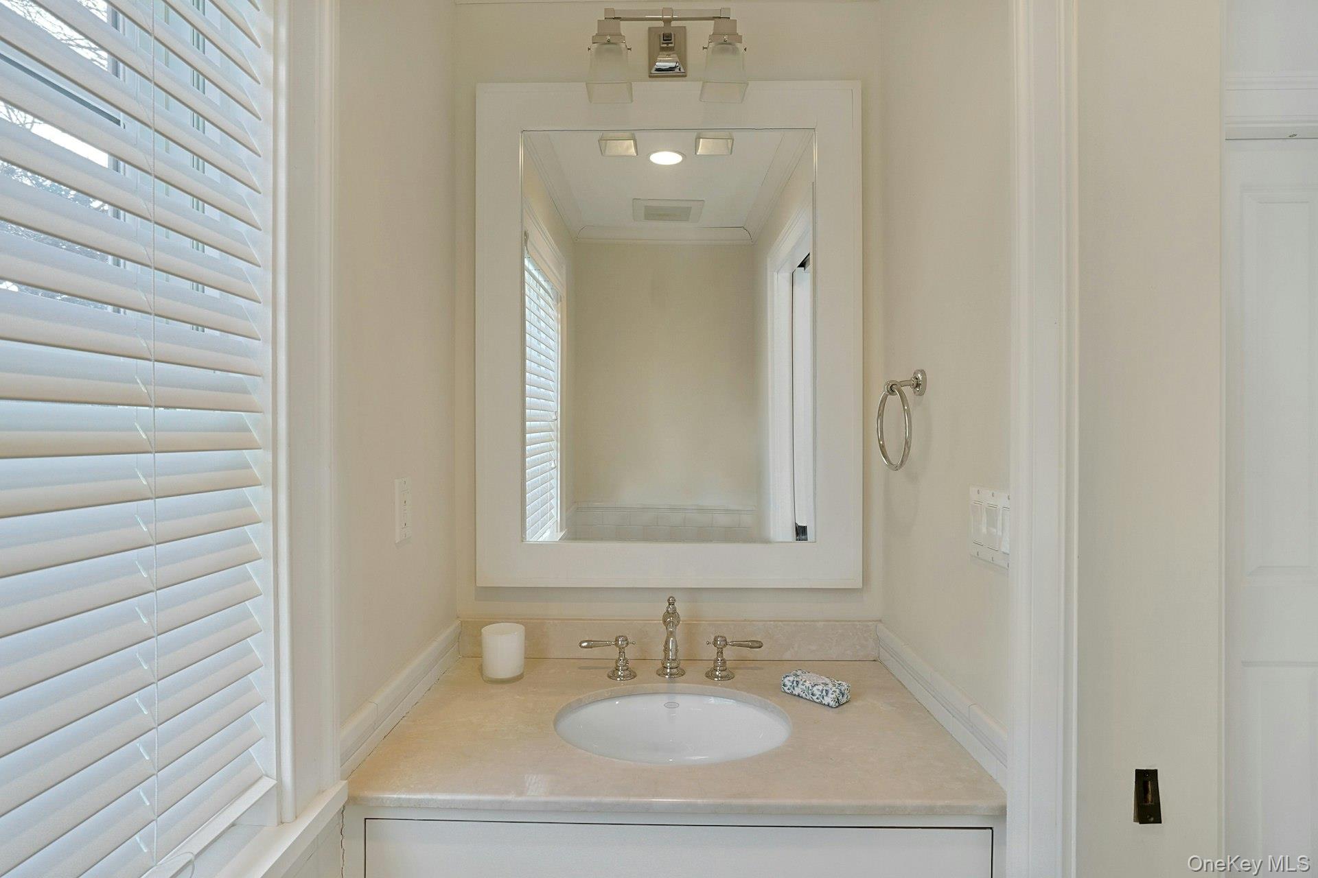 34 Park Road Scarsdale, NY 10583 - Photo 40 of 49 a bathroom with a sink and a mirror