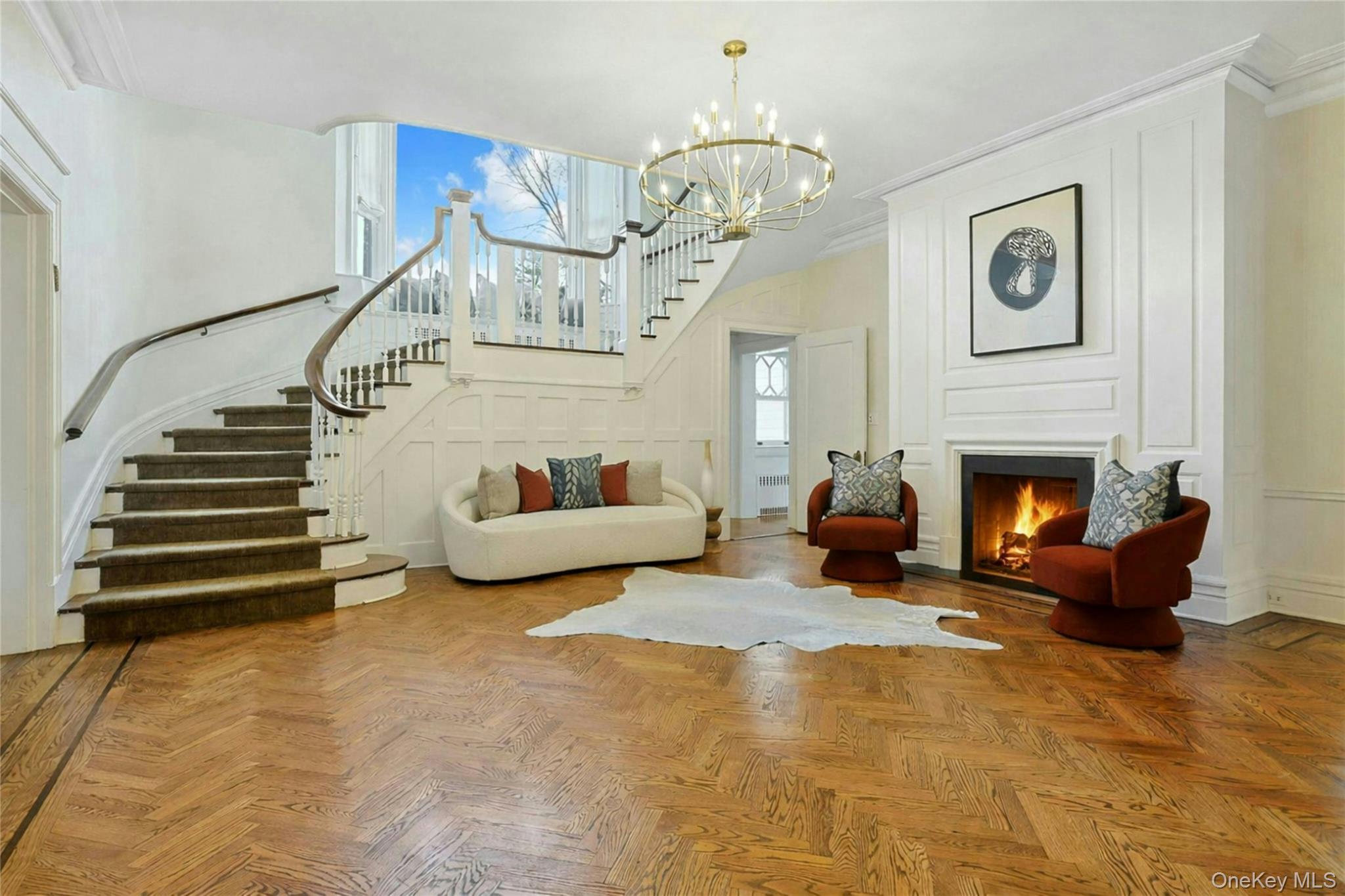 34 Park Road Scarsdale, NY 10583 - Photo 4 of 49 a living room with furniture and a chandelier