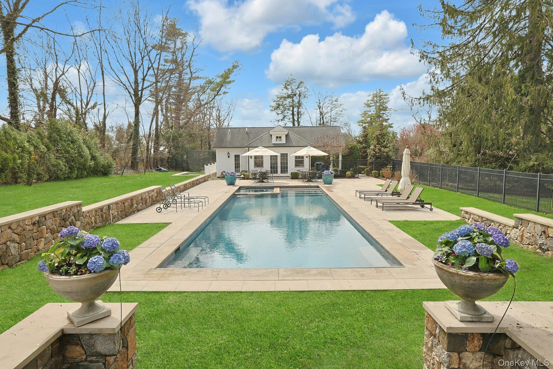 34 Park Road Scarsdale, NY 10583 - Photo 43 of 49 a view of a backyard with sitting area