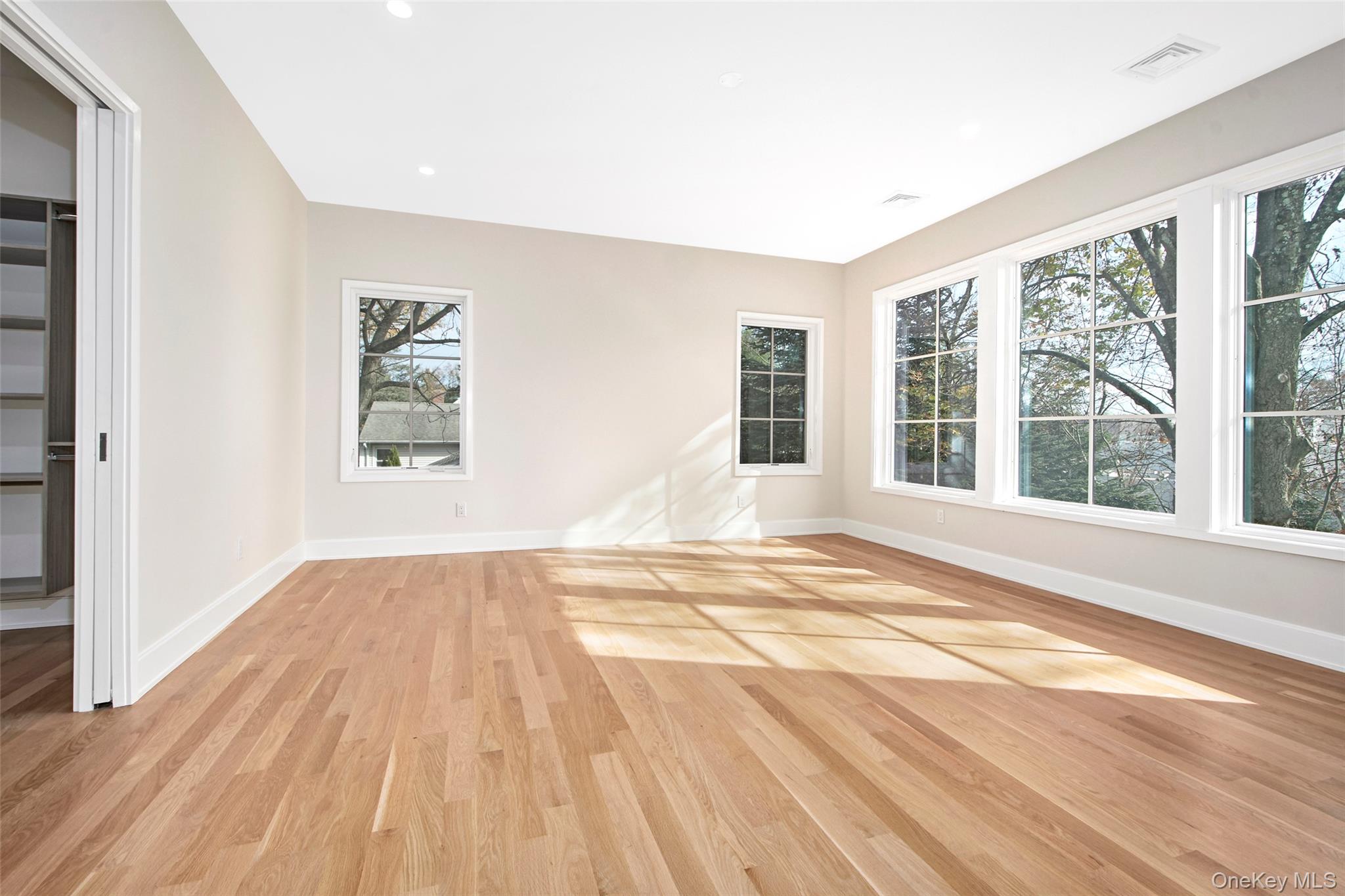 2 Myrtledale Road Scarsdale, NY 10583 - Photo 11 of 33 a view of an empty room with wooden floor and a window