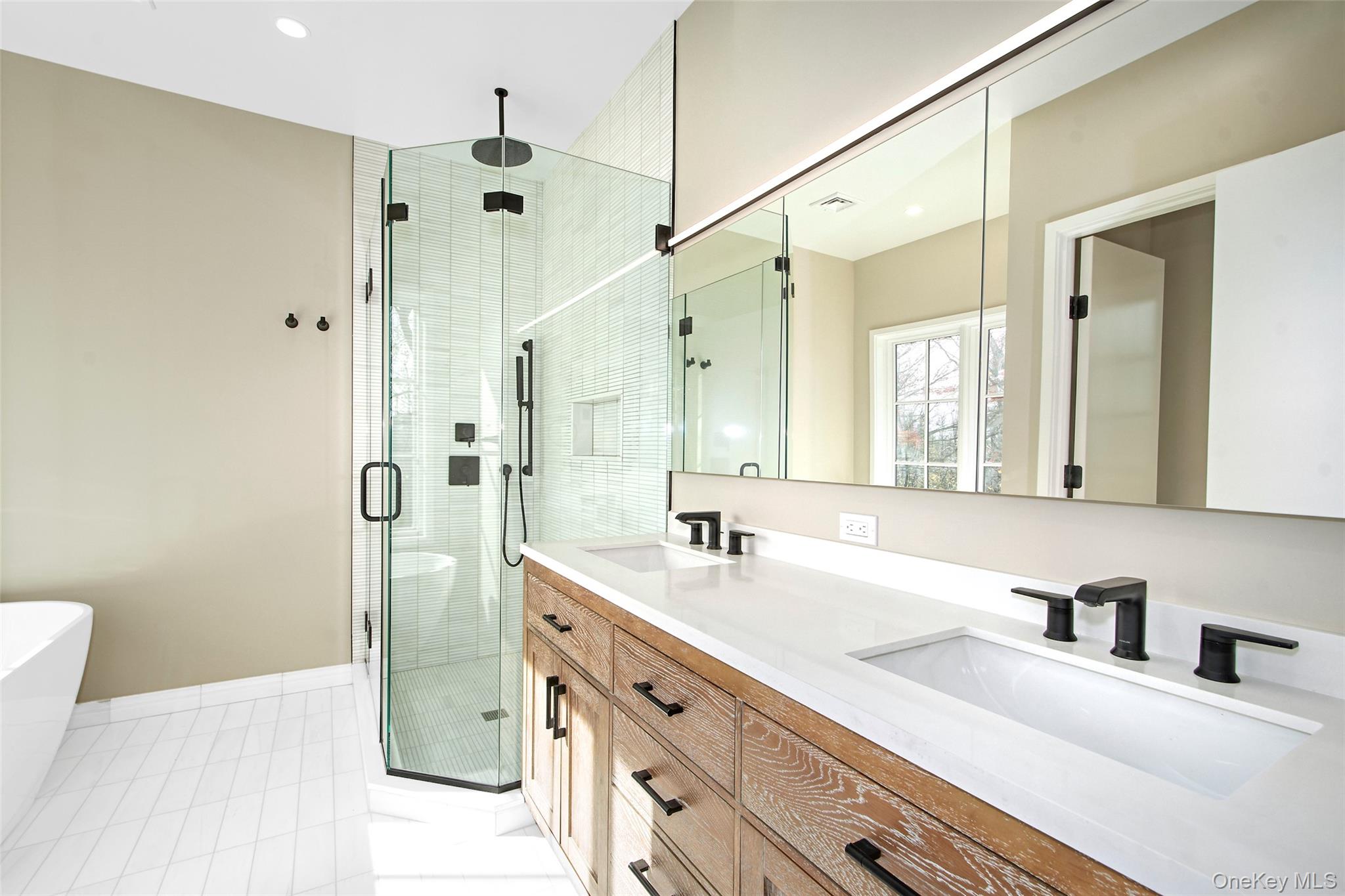 2 Myrtledale Road Scarsdale, NY 10583 - Photo 13 of 33 a bathroom with double vanity sink a mirror and a shower