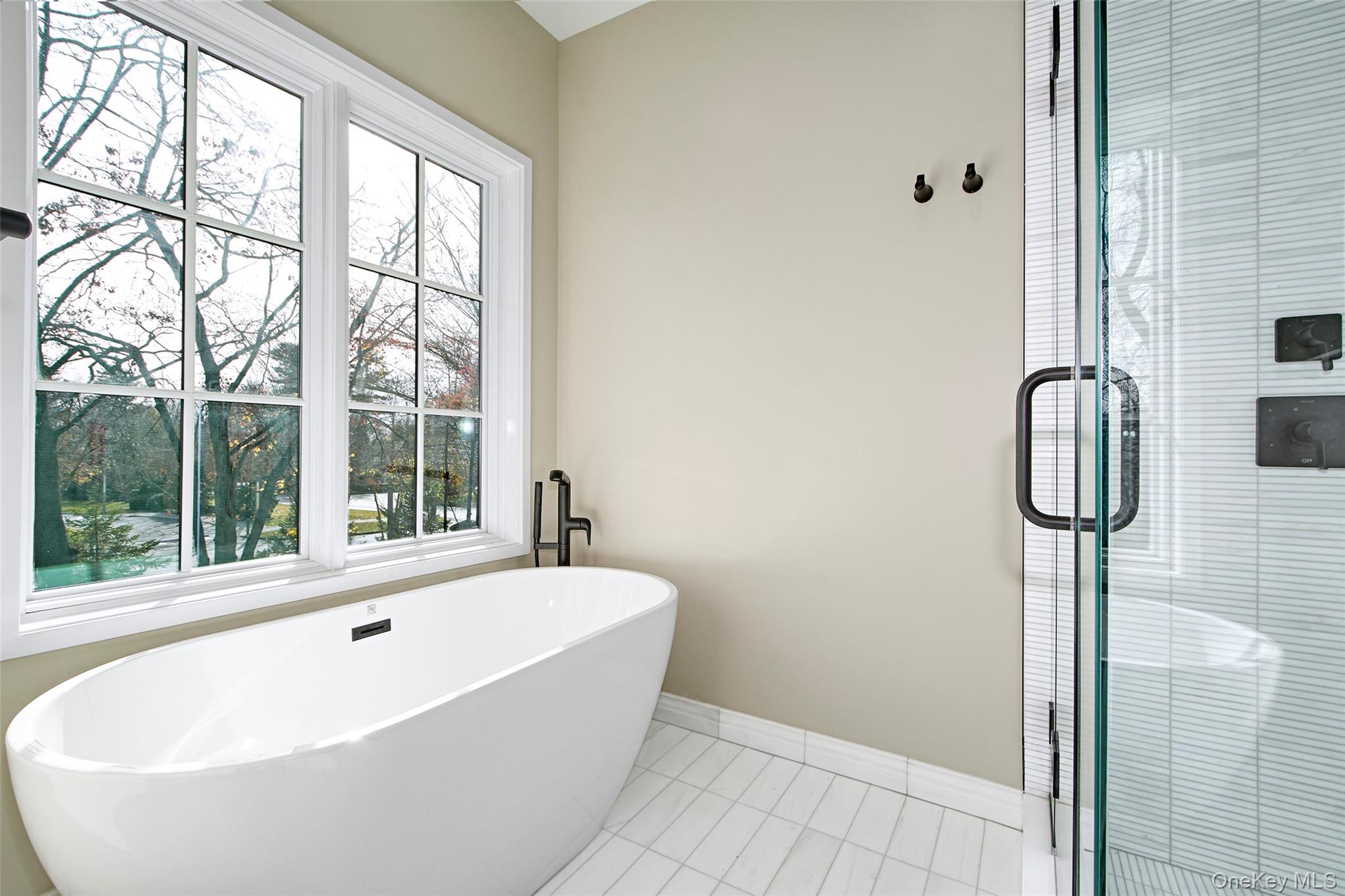 2 Myrtledale Road Scarsdale, NY 10583 - Photo 14 of 33 a bathroom with bathtub and window