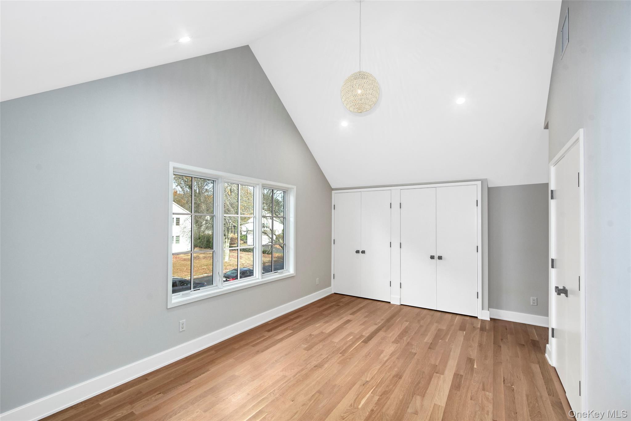 2 Myrtledale Road Scarsdale, NY 10583 - Photo 24 of 33 an empty room with wooden floor and windows