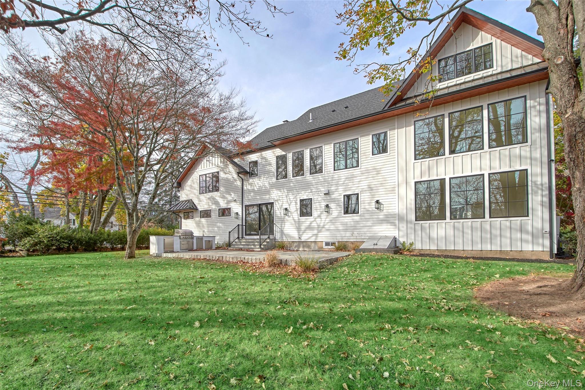 2 Myrtledale Road Scarsdale, NY 10583 - Photo 28 of 33 a front view of a house with a yard