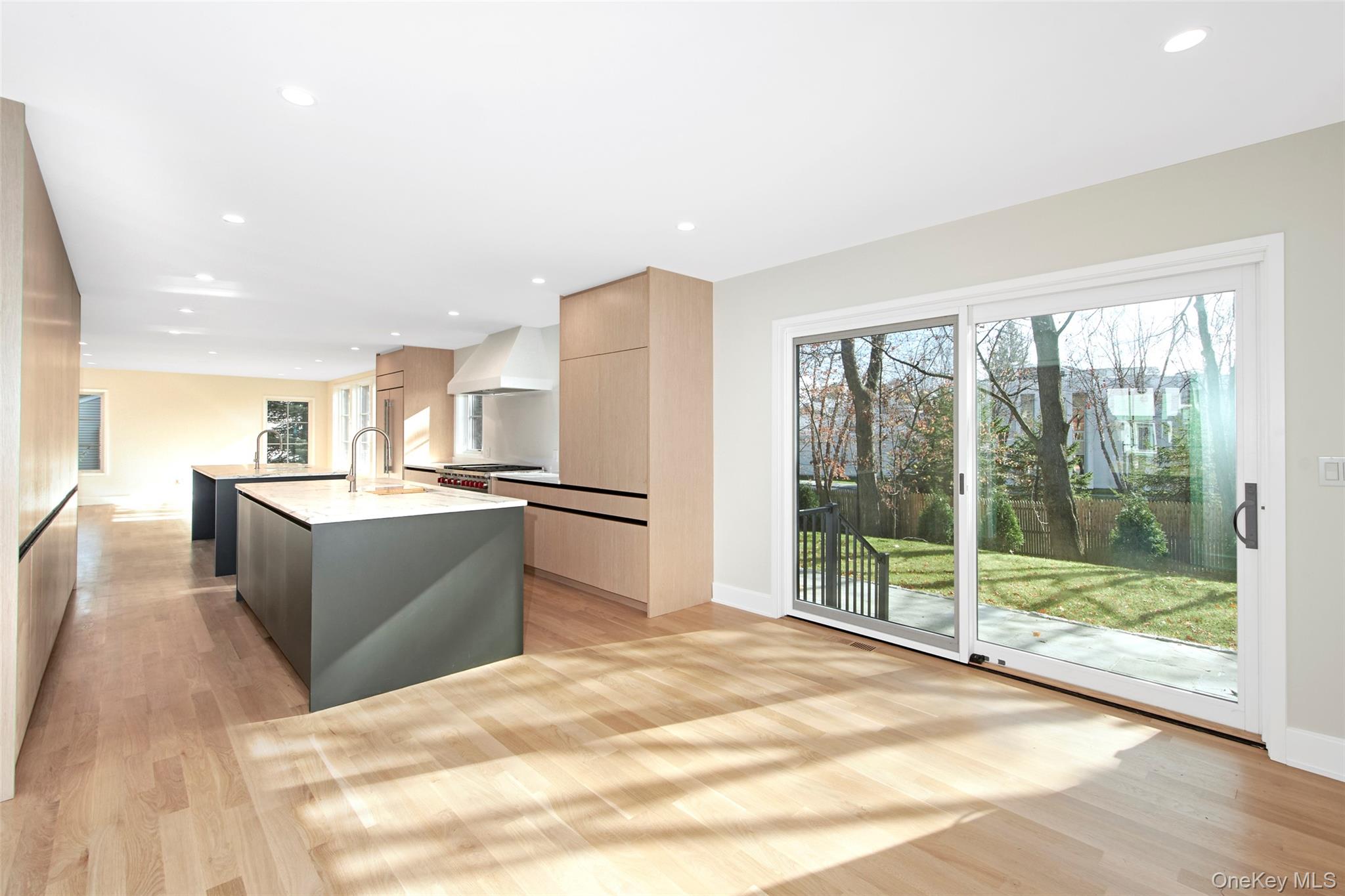 2 Myrtledale Road Scarsdale, NY 10583 - Photo 5 of 33 a large white kitchen with granite countertop a large window and a sink