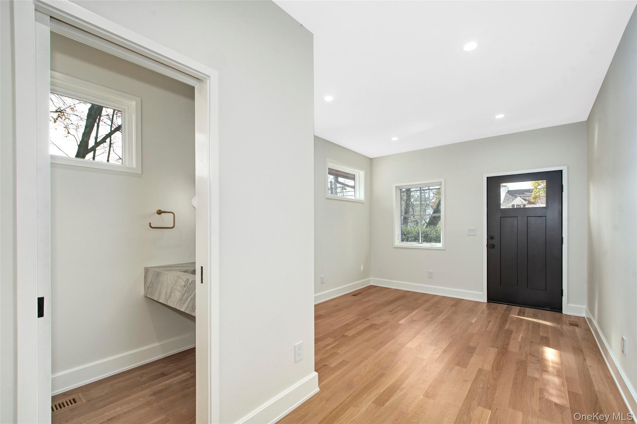 2 Myrtledale Road Scarsdale, NY 10583 - Photo 10 of 33 a view of hallway with window and wooden floor
