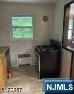 743 Newcomb Road Ridgewood, NJ 07450 - Photo 12 of 19 a kitchen with a stove and a window