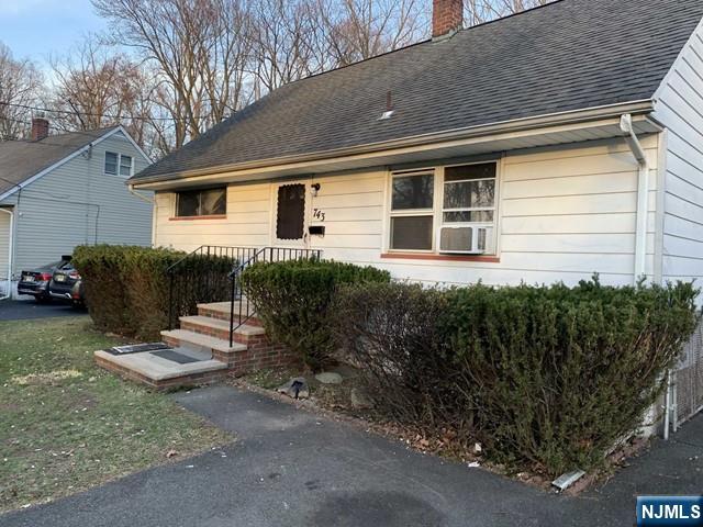 743 Newcomb Road Ridgewood, NJ 07450 - Photo 2 of 19 a backyard of a house with seating space