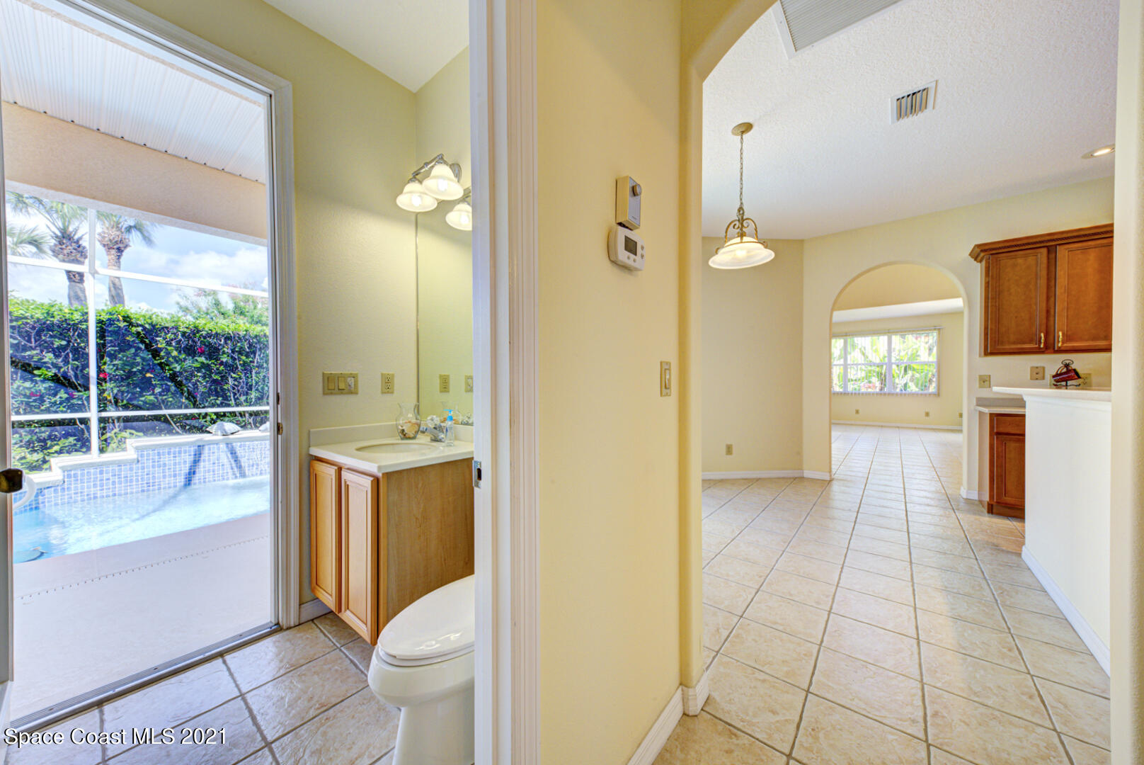 8206 Simpkins Way Melbourne, FL 32940 - Photo 19 of 66 bathroom 2 with cabana door (1)
