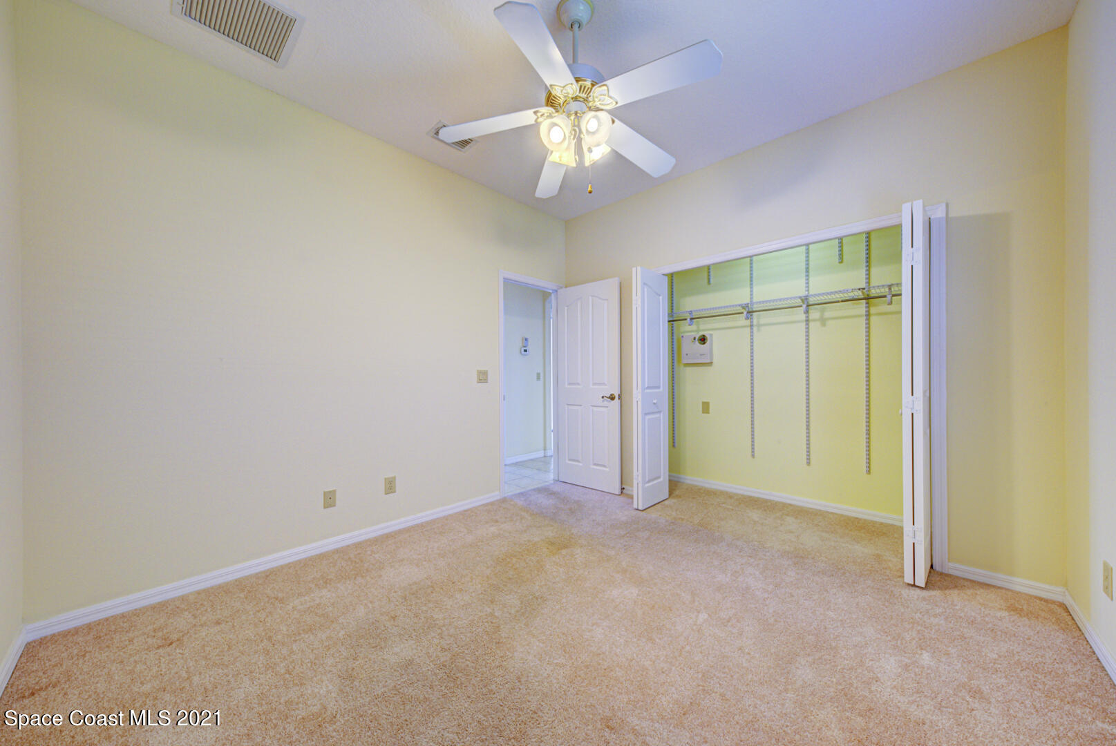 8206 Simpkins Way Melbourne, FL 32940 - Photo 23 of 66 bedroom 2 with closet system (1)